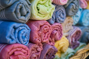 brightly colored towels rolled up