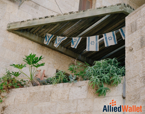 wooden rooftop decorated with Israel flags