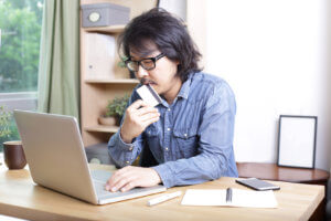 guy thinking at computer